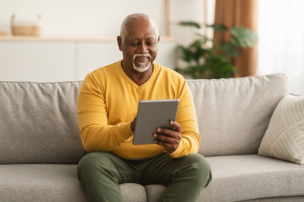 Older man using a mobile tablet